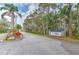 Welcoming entrance to Hernando Beach South, a deed-protected community, with lush landscaping at 4010 Jewfish Dr, Hernando Beach, FL 34607