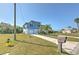 Lovely blue two-story home with a well maintained lawn and lush landscaping at 4010 Jewfish Dr, Hernando Beach, FL 34607