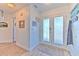 Welcoming foyer with decorative double doors and neutral flooring at 4010 Jewfish Dr, Hernando Beach, FL 34607