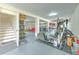 View of the spacious garage, featuring access to stairs, storage, and exercise equipment at 4010 Jewfish Dr, Hernando Beach, FL 34607