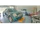 Bright garage featuring a compact car, storage containers, and room for leisure at 4010 Jewfish Dr, Hernando Beach, FL 34607