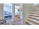 Hallway view of guest bedroom, bathroom, and staircase with wood steps at 4010 Jewfish Dr, Hernando Beach, FL 34607