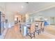 Kitchen with island, bar seating, and open view to the dining and living area at 4010 Jewfish Dr, Hernando Beach, FL 34607