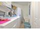 Well-equipped laundry room with appliances and storage solutions at 4010 Jewfish Dr, Hernando Beach, FL 34607