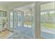 Bright open doors leading to a screened porch and scenic water views at 4010 Jewfish Dr, Hernando Beach, FL 34607