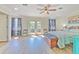 Spacious main bedroom with French door access to deck and coastal decorations at 4010 Jewfish Dr, Hernando Beach, FL 34607