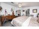 Bright bedroom with a wooden dresser, bed and connected bathroom at 4100 Ernest Dr, Wesley Chapel, FL 33543