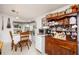 Cozy breakfast nook with natural light, wood table set and decorative hutch at 4100 Ernest Dr, Wesley Chapel, FL 33543
