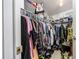 A large closet featuring ample storage with multiple shelves and racks for clothing and accessories at 4100 Ernest Dr, Wesley Chapel, FL 33543