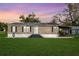 Charming single-story home with well-maintained lawn and inviting front entrance, perfect for suburban living at 4100 Ernest Dr, Wesley Chapel, FL 33543
