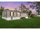 Single-story home with covered parking, set on a spacious lot, offering suburban comfort and outdoor space at 4100 Ernest Dr, Wesley Chapel, FL 33543