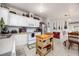 Charming kitchen with white cabinets, appliances, and decorative accents at 4100 Ernest Dr, Wesley Chapel, FL 33543