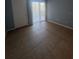 Cozy bedroom featuring neutral paint and tile flooring at 455 Alt 19 S # 217, Palm Harbor, FL 34683