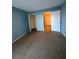 Bedroom showing a doorway to the walk-in closet and attached bath at 455 Alt 19 S # 217, Palm Harbor, FL 34683