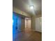 Bedroom featuring built-in shelves, tile flooring, and a double door closet at 455 Alt 19 S # 217, Palm Harbor, FL 34683