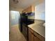 Kitchen featuring wooden cabinets, stainless-steel appliances, and tile flooring at 455 Alt 19 S # 217, Palm Harbor, FL 34683