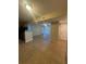 Open-concept living space featuring neutral tones, tiled flooring, and abundant natural light at 455 Alt 19 S # 217, Palm Harbor, FL 34683