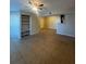 Open-concept living space with tiled flooring and a layout that flows into the kitchen area at 455 Alt 19 S # 217, Palm Harbor, FL 34683