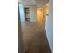 Open-concept living room with tile floors, a built-in shelf, and views into other spaces at 455 Alt 19 S # 217, Palm Harbor, FL 34683