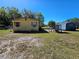 Wide angle shot of house with small shed in the backyard at 4905 Horton Rd, Plant City, FL 33567