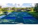 Aerial shot of tennis and pickleball courts offering a great recreational amenity at 5050 Elm Leaf Dr, Brooksville, FL 34601