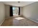 Cozy bedroom featuring a window overlooking the pond and tile flooring at 5618 Pinnacle Heights Cir # 104, Tampa, FL 33624