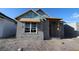 Exterior view of a block constructed home in process of being built with exposed beams and window frame at 7263 Kodiak Ln, Sarasota, FL 34240