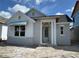 Charming single-story home featuring a covered entrance and light-colored exterior with bright white trim at 7263 Kodiak Ln, Sarasota, FL 34240