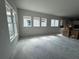 Spacious living room area, brightly lit with windows and open to the kitchen at 7263 Kodiak Ln, Sarasota, FL 34240
