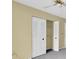 Bedroom closet with bifold doors features shelving for easy storage at 7807 Hardwick Dr # 115, New Port Richey, FL 34653