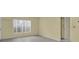 Light-filled living room featuring tile flooring, a window, and neutral paint color at 7807 Hardwick Dr # 115, New Port Richey, FL 34653