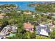 Waterfront home nestled among lush trees and landscaping, offering serene views and a private setting at 808 Idlewood Ave, Tampa, FL 33609