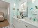 Bathroom with double sinks, a large mirror, and lots of counter space at 808 Idlewood Ave, Tampa, FL 33609