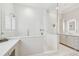 Bright bathroom boasts a glass shower, white tile, vanity, and modern fixtures at 808 Idlewood Ave, Tampa, FL 33609