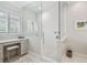 Bright bathroom features a glass shower, vanity area, and white tile throughout at 808 Idlewood Ave, Tampa, FL 33609