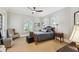 Bedroom with neutral walls, carpet, windows with shutters, and wicker bed frame at 808 Idlewood Ave, Tampa, FL 33609
