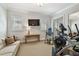Exercise Room including workout equipment, sofa, and TV at 808 Idlewood Ave, Tampa, FL 33609