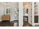 Inviting foyer with hardwood floors, natural light, and view into adjacent room, offering a warm welcome at 808 Idlewood Ave, Tampa, FL 33609