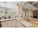 Open kitchen with granite countertops, stainless steel appliances and a dining area at 808 Idlewood Ave, Tampa, FL 33609