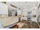 Well-lit kitchen featuring granite countertops, stainless steel appliances, and ample white cabinetry at 808 Idlewood Ave, Tampa, FL 33609