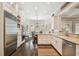 Spacious kitchen with granite countertops, stainless steel appliances and adjacent dining area at 808 Idlewood Ave, Tampa, FL 33609