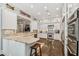 Bright kitchen with granite countertops, stainless steel appliances, and white cabinets, perfect for cooking at 808 Idlewood Ave, Tampa, FL 33609