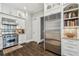 Bright kitchen features stainless steel appliances, granite countertops and white cabinetry at 808 Idlewood Ave, Tampa, FL 33609