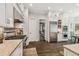 Bright kitchen features stainless steel appliances, granite countertops and white cabinetry at 808 Idlewood Ave, Tampa, FL 33609