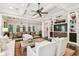 Elegant living room featuring coffered ceilings, a fireplace, and seamless flow to the dining area at 808 Idlewood Ave, Tampa, FL 33609