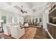 Spacious living room and dining area with hardwood floors, coffered ceilings, and an inviting atmosphere at 808 Idlewood Ave, Tampa, FL 33609