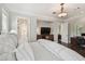 Bright and spacious bedroom with wood floors and walk-through access to the bathroom at 808 Idlewood Ave, Tampa, FL 33609
