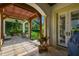 The stone-paved patio has a pergola roof, and offers backyard views at 808 Idlewood Ave, Tampa, FL 33609