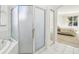 Bathroom with glass shower and tub next to the Main Bedroom that has a large window view at 10211 Quails Landing Ave, Tampa, FL 33647