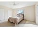 Cozy bedroom featuring a queen size bed, neutral color palette and double closets at 10211 Quails Landing Ave, Tampa, FL 33647